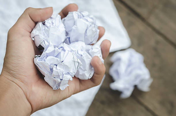 istock Texture of crumpled paper on wood board background 543343370