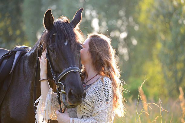 istock Young woman with horse 543343850