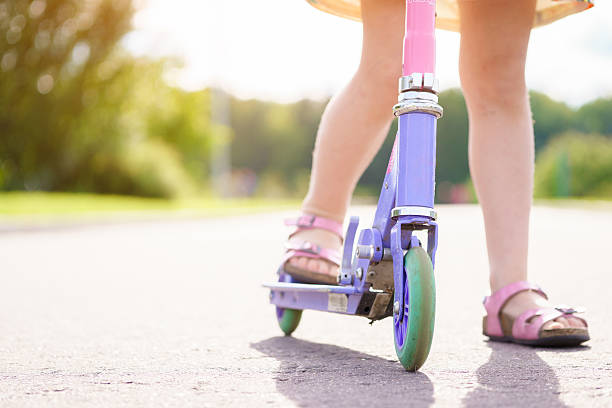 istock Closeup view with legs on scooter 543344080