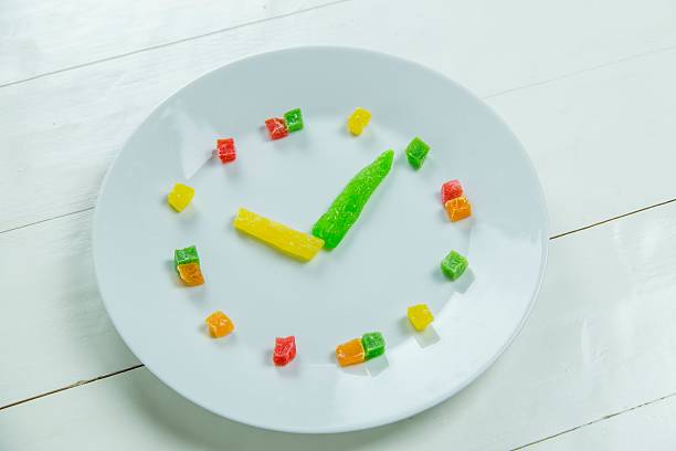 istock Fruit clock with candied fruits 543344140