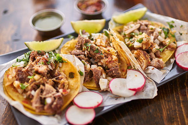 istock three street tacos in yellow corn tortilla with different meats 543344166