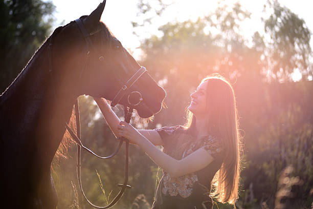 istock Young woman with horse 543344302