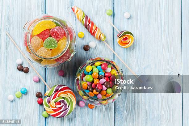 Colorful Candies On Wooden Table Stock Photo - Download Image Now - Candy, Jar, Sweet Food