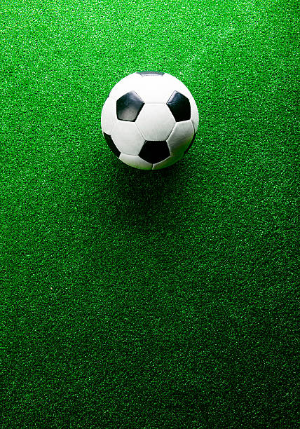 istock Soccer ball against artificial turf. Studio shot. Copy space. 543346368