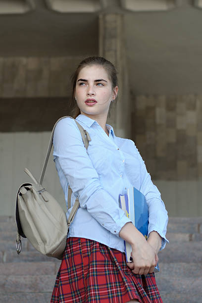 istock Girl student with books in her hand 543346522