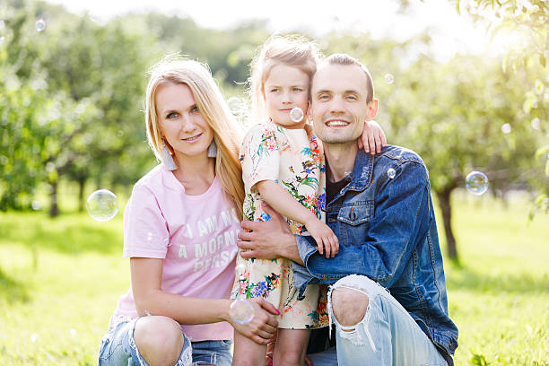 istock Family playing in the park on the grass 543346590