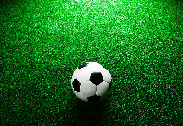 istock Soccer ball against artificial turf. Studio shot. Copy space. 543346628