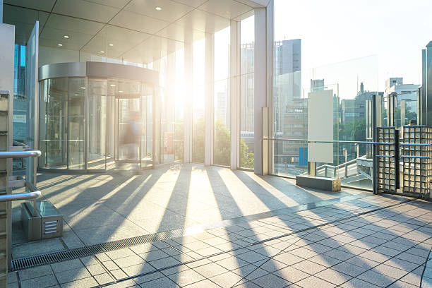 istock empty footpath through modern office buildings in tokyo with sun 543348140