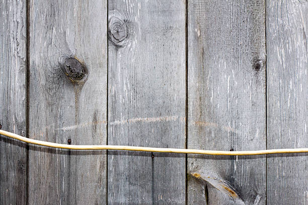 istock Plank (board) and electric cable. Old and cracked. 543348638