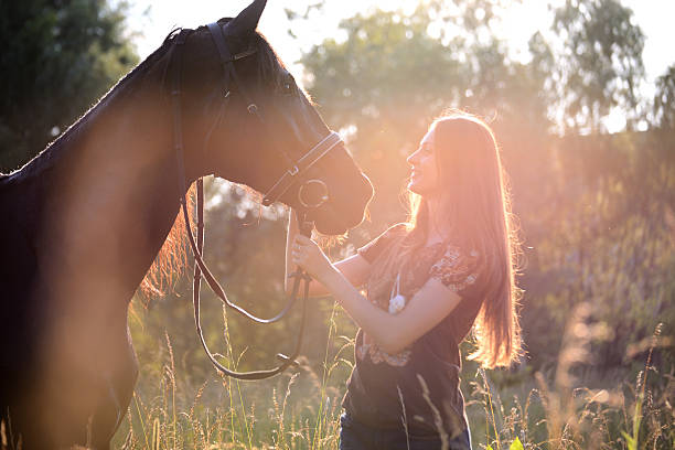 istock Young woman with horse 543348692