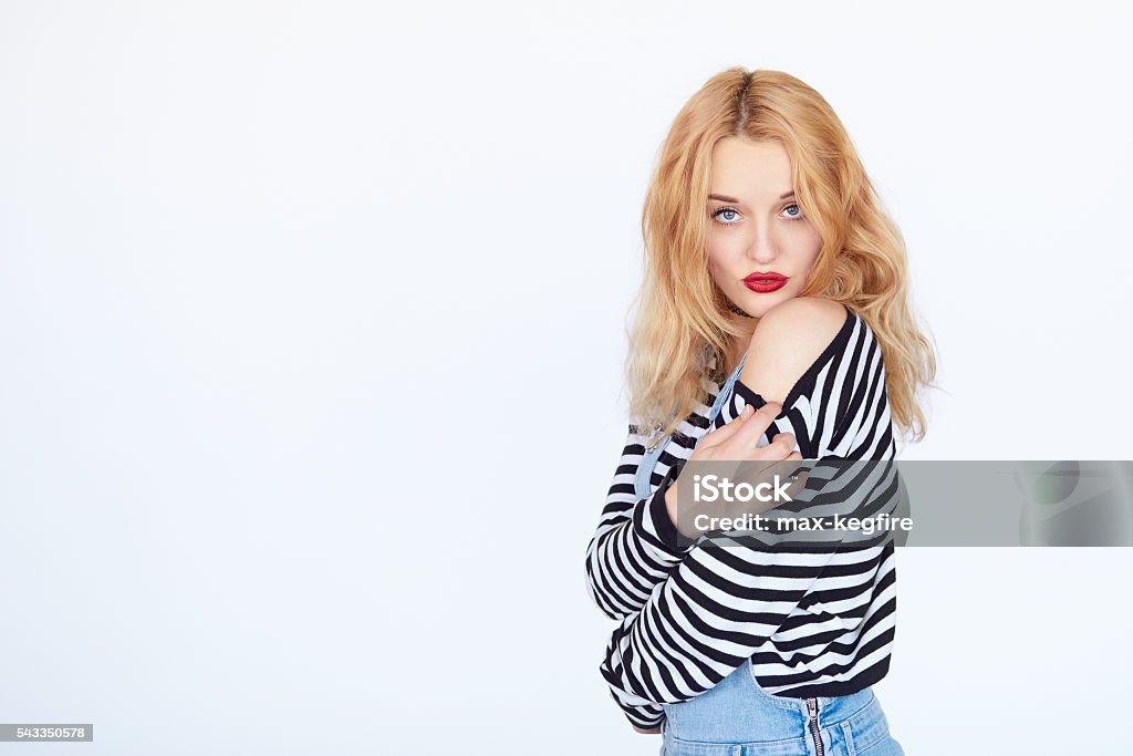 Attractive Girl Taking Off Her Clothes Stock Photo - Download Image Now - Adjusting, Adult, Arts Culture and Entertainment - iStock