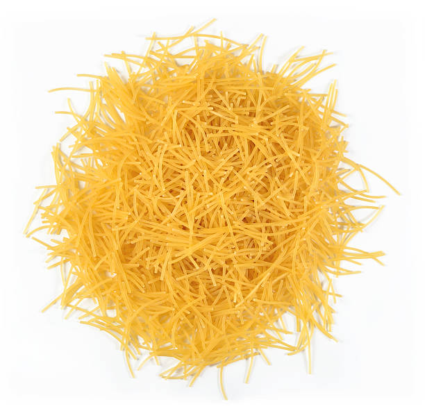 istock Heap of uncooked italian pasta on a white 543351446