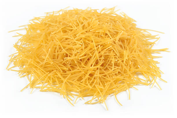 istock Heap of uncooked italian pasta on a white 543351468