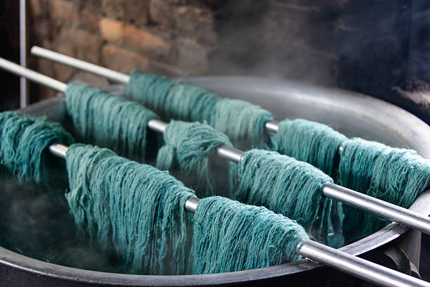 Traditional wool dying Natural wool dyeing in a carpet factory, Nepal dye stock pictures, royalty-free photos & images