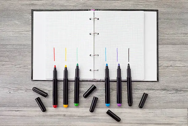 supplies for pencil drawing in school on a wooden table