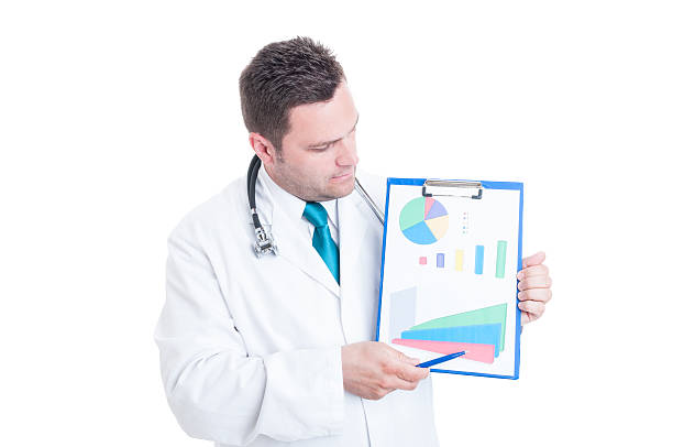 istock Male medic looking at statistics on clipboard 543353630