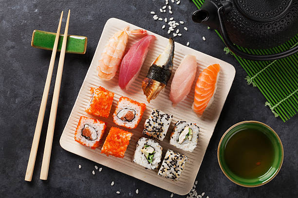 istock Set of sushi, maki and green tea 543354352