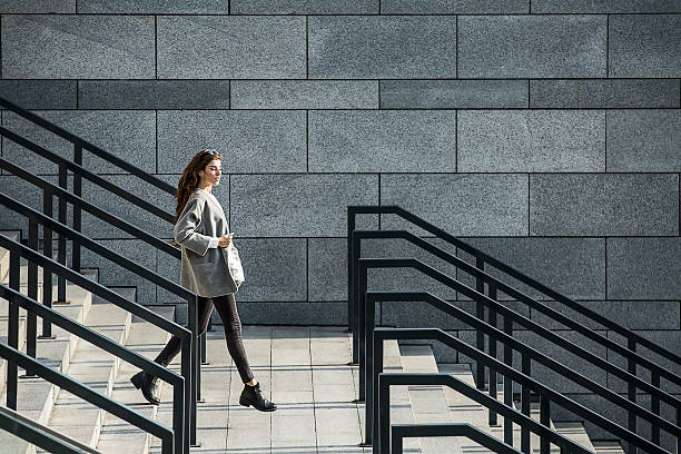 istock Girl walks on stair 543356660