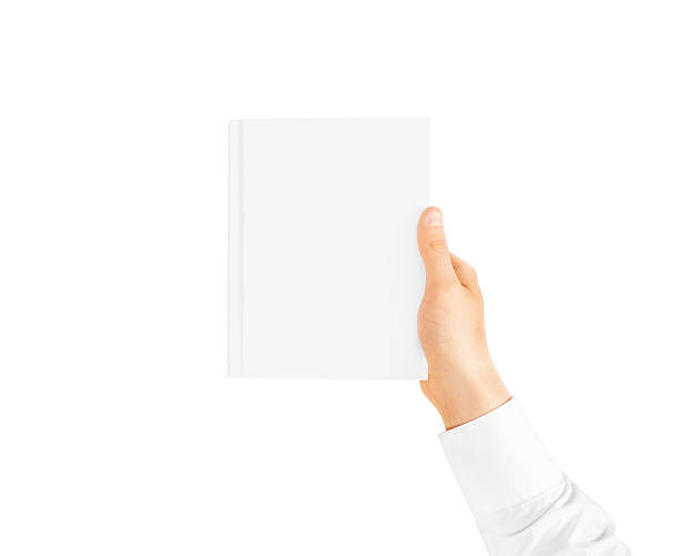 istock Hand in white shirt sleeve holding closed blank book. 543357672