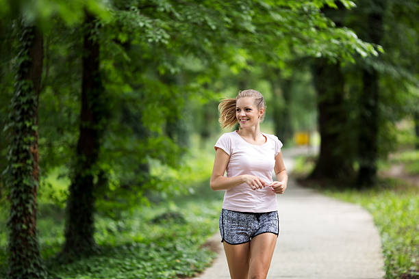 istock Beautiful female jogger in nature 543357818