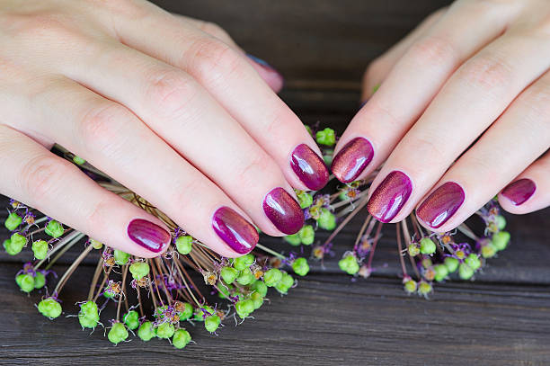 istock Woman fingernails with pink manicure 543357996