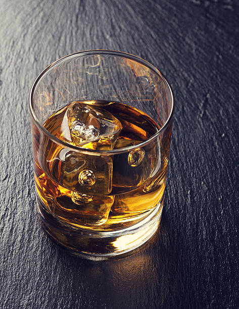 istock Glass of scotch whiskey with ice 543358626