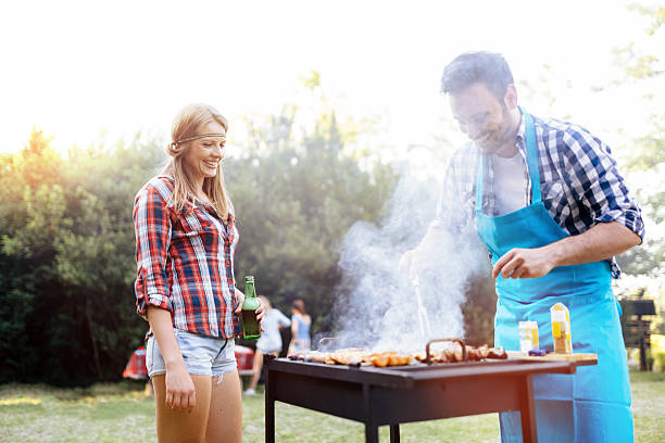 istock Young people grilling outdoors 543359066