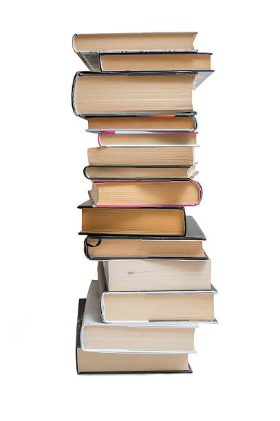 istock Stacked books isolated on white background. 543359170