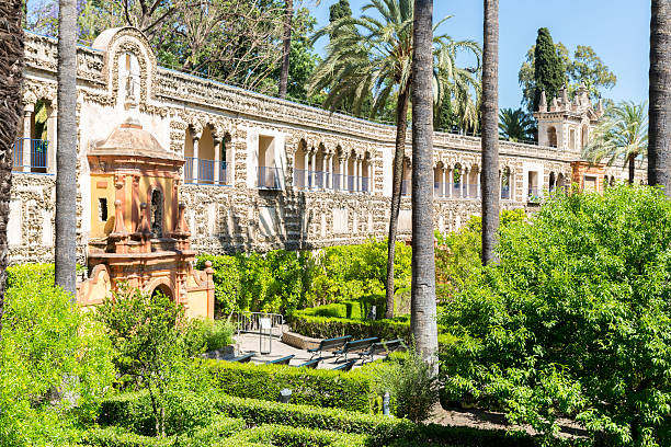 Seville Alcazar Spain Seville, Spain- June 4: Garden of Royal Alcazars of Seville on Jun 4, 2014. Royal Alcazars of Seville is the oldest royal palace still in use in Europe. ancient creativity andalusia architecture stock pictures, royalty-free photos & images