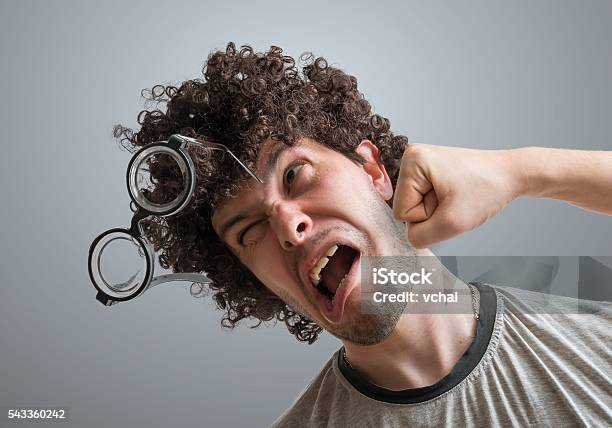 Funny Man Is Getting Punch In Face With Fist Stock Photo - Download Image Now - Human Face, Punching, Humor