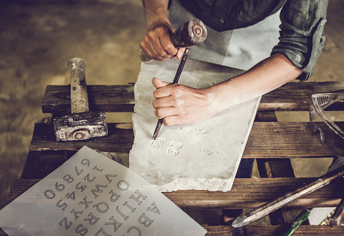 Stonecutter woman portrait at work, Ljubljana, Slovenia