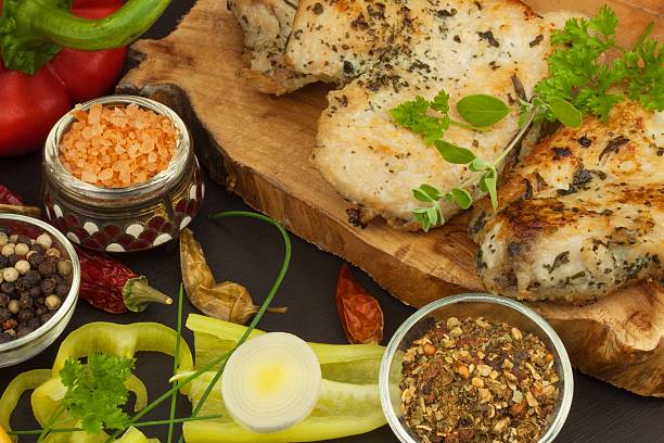 istock Grilled chicken steak with spices and vegetable. 543361022