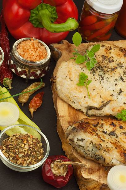 istock Grilled chicken steak with spices and vegetable. 543361104