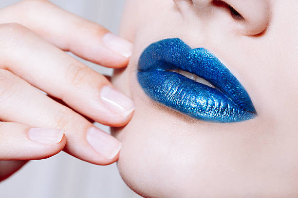 istock Woman lips with glossy blue lipstick 543362334