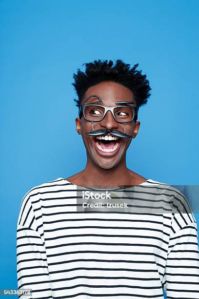 Excited Afro American Young Man Wearing Funny Glasses Stock Photo - Download Image Now