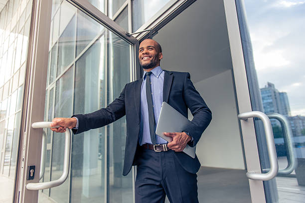 Afro American businessman with gadget