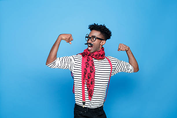 istock Strong afro american guy in a french outfit flexing bicep 543442232