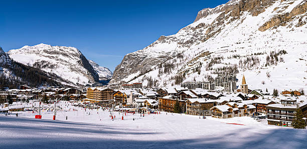 Val d'Isère city Val D'Isere, France - Febuary 10, 2015: view of the mountain town Val d'Isere, France. Skiing in Val d'Isere has its roots in the 1930s when a drag lift was built on the slopes of Solaise game resort pictures stock pictures, royalty-free photos & images