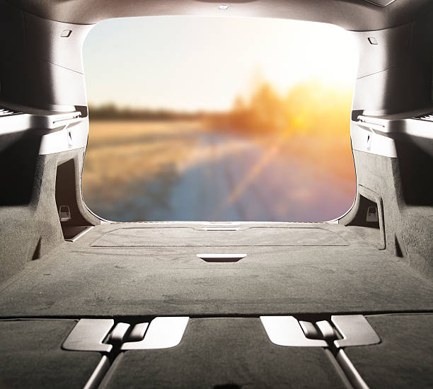View from the trunk. Sunny day in a country side. View from the trunk. Sunny day in a country side, car interior, road with sunlight car back open stock pictures, royalty-free photos & images