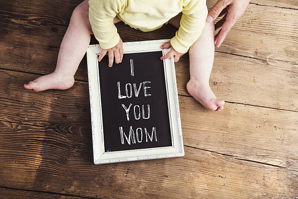 Mothers day composition. Picture frame. Wooden background. Studi