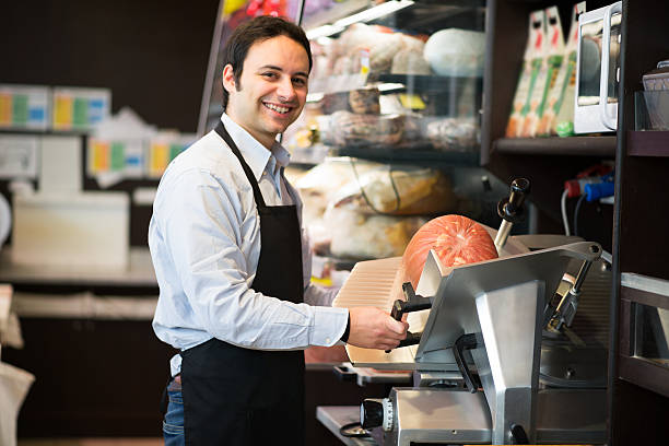 istock Shopkeeper cutting Italian sliced meat 543443004