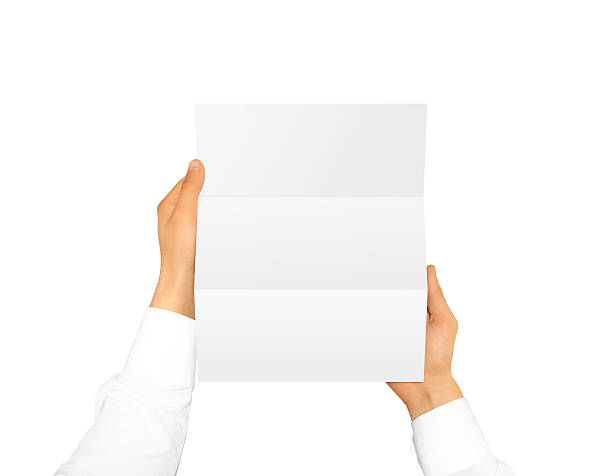 Hand holding blank brochure booklet leaflet