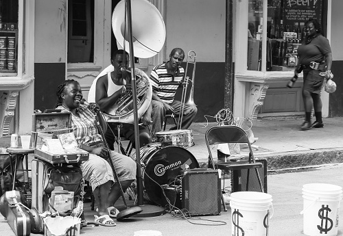 New Orleans, United States - May 14, 2015: Band playing live music on Royal Street in French Quarter. The picture is monochrome.