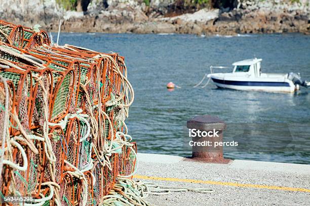 Fishing Net Baskets Mooring Post Boat On A Harbor Dock Stock Photo -  Download Image Now - iStock