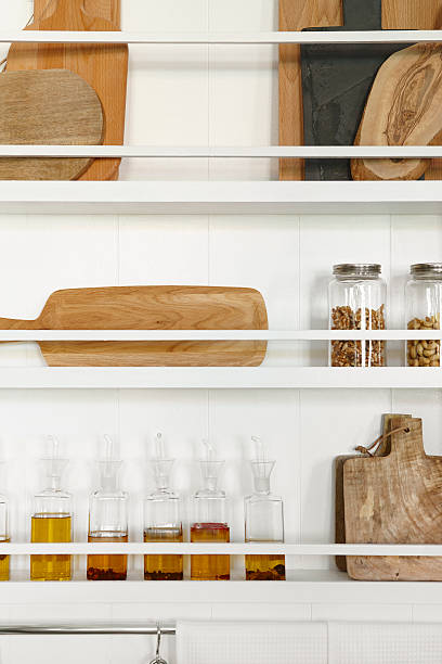 istock Kitchen rackets cabinets with oil bottles and accessories 543445716