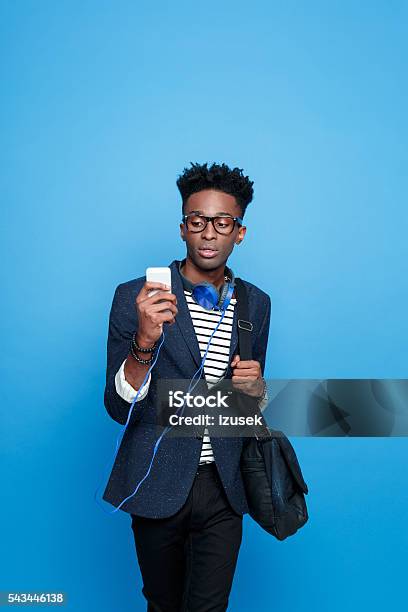 Fashionable Afro American Guy Using A Smart Phone Stock Photo - Download Image Now - Adult, Adults Only, African Ethnicity
