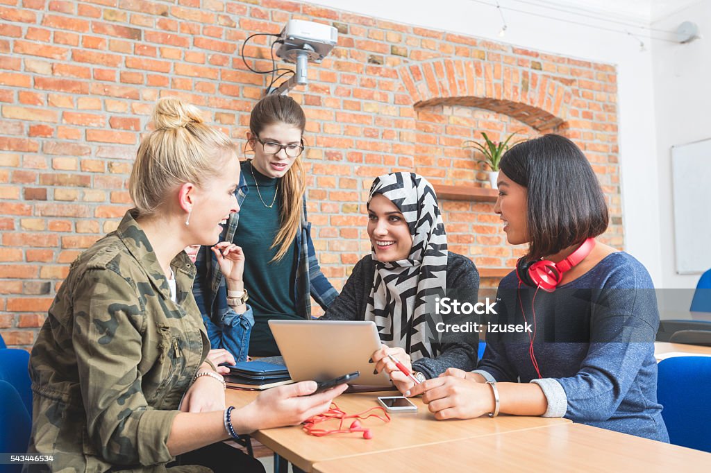 Musilm young woman learing together with her firends Musilm female student working on laptop with her friends at the university. Technology Stock Photo