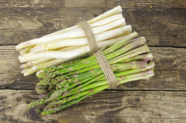 istock bundle of white and green asparagus 543447236