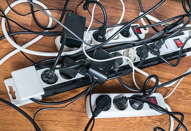 istock Electricity consumption concept. Many cables of electrical home appliances. 543447756