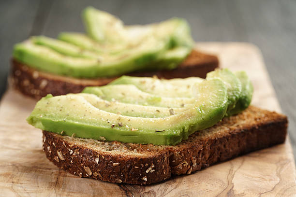 istock toasted rye bread with sliced avocado and herbs 543448268